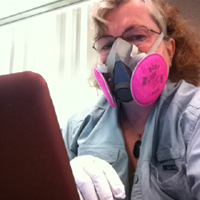 photo of Deb Scott in particle mask and nitrile gloves